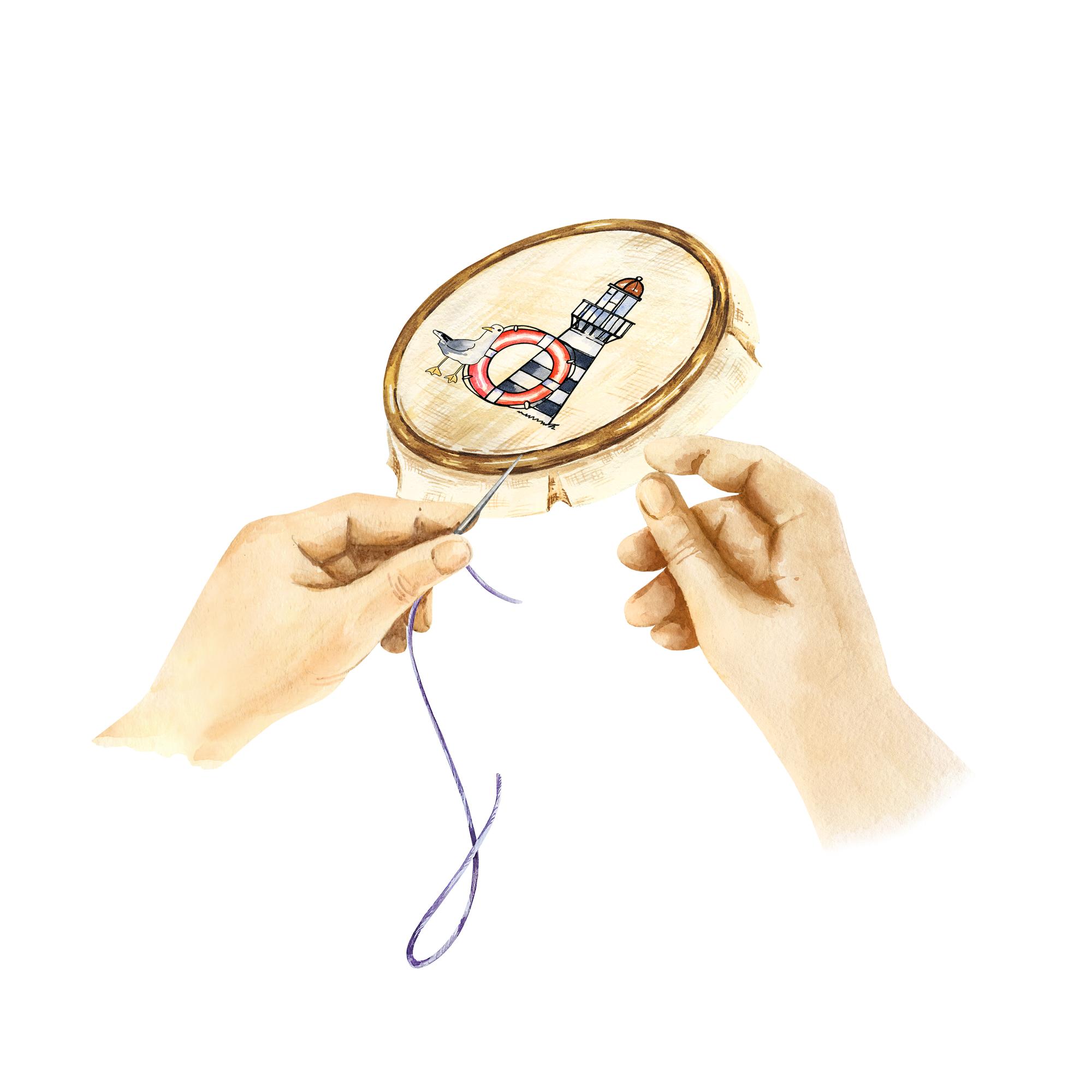 hands inspecting embroidered badge under lamp