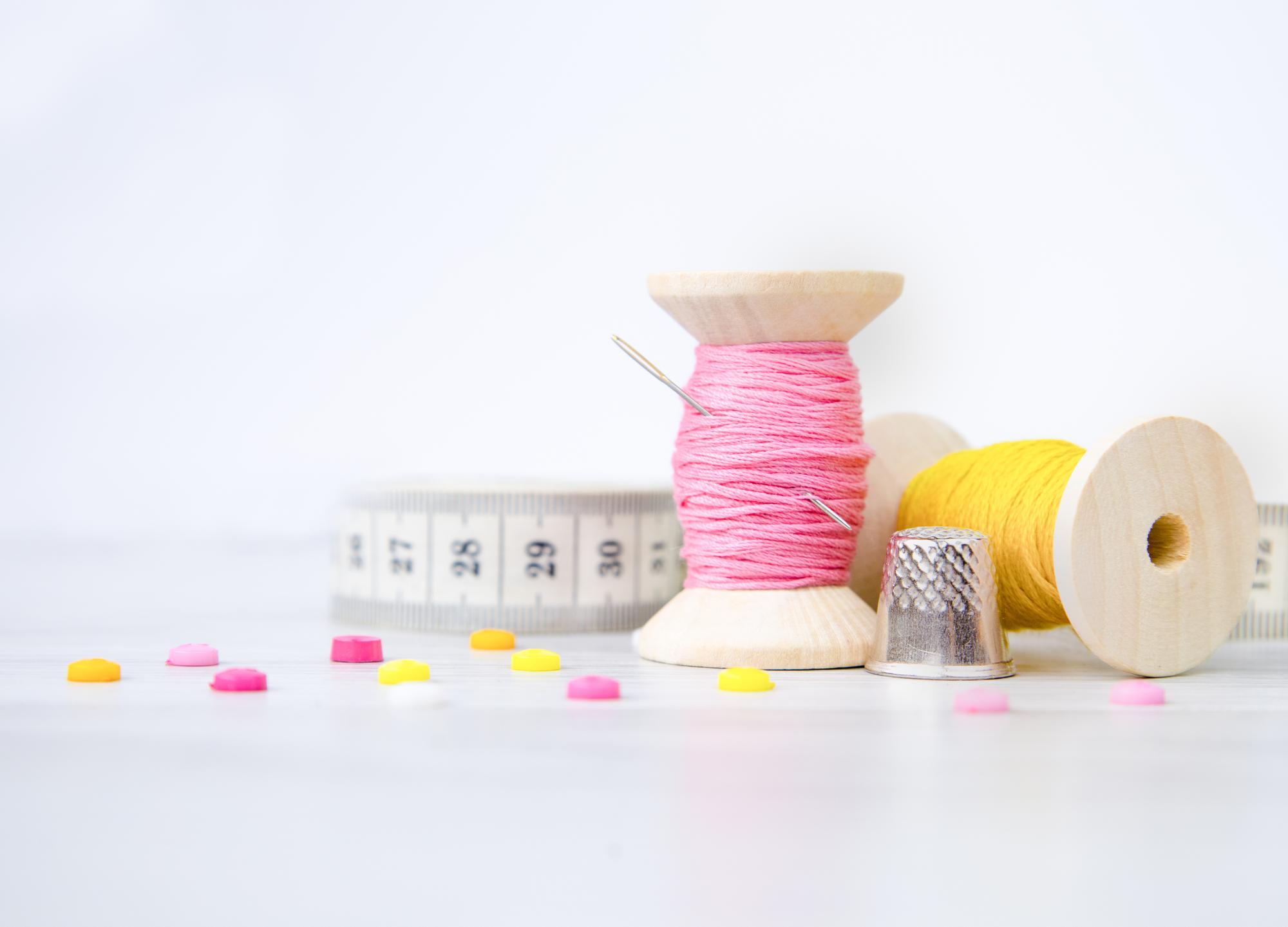 studio bench with hoops and thread spools